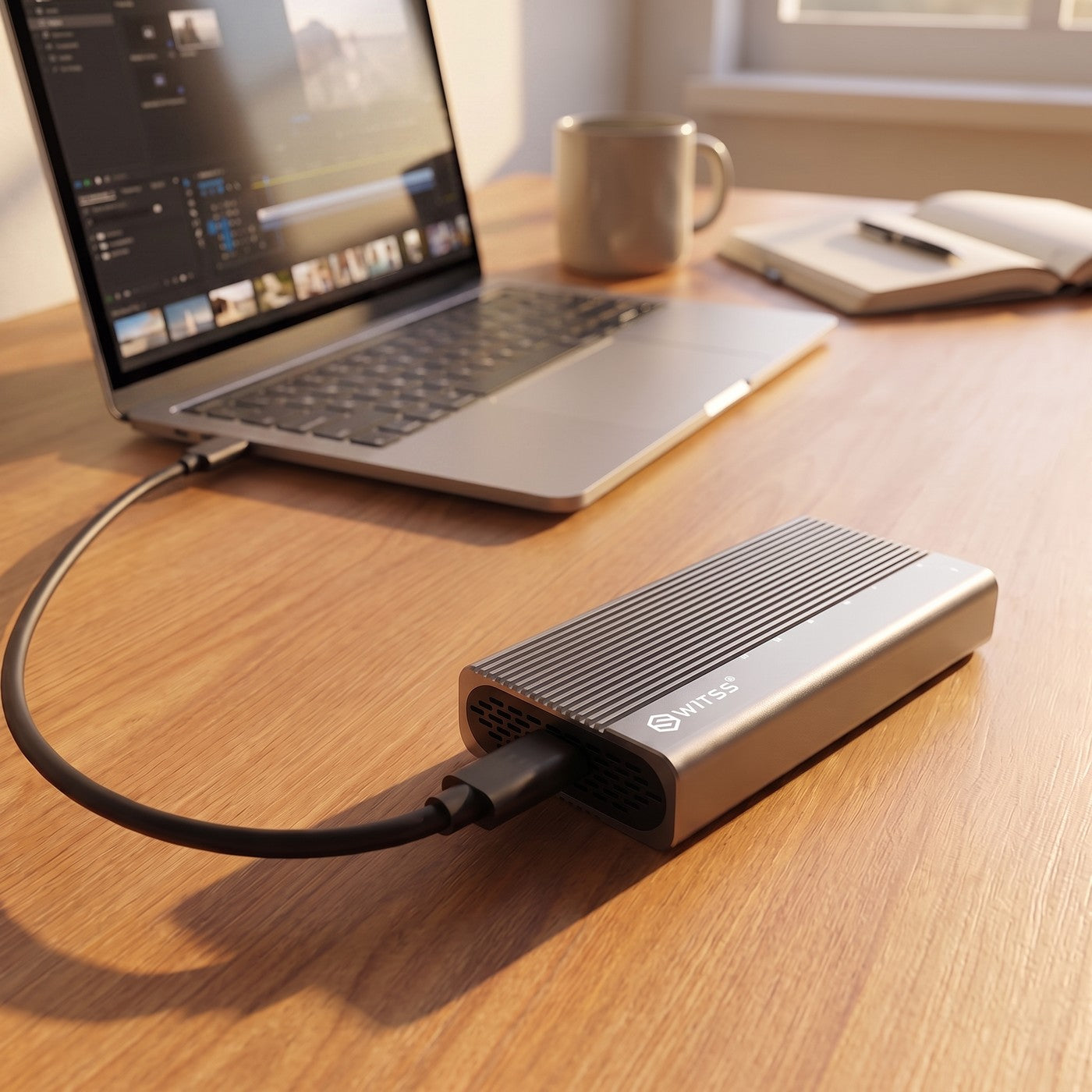Switss® USB4 M.2 enclosure connected to a laptop during a file transfer