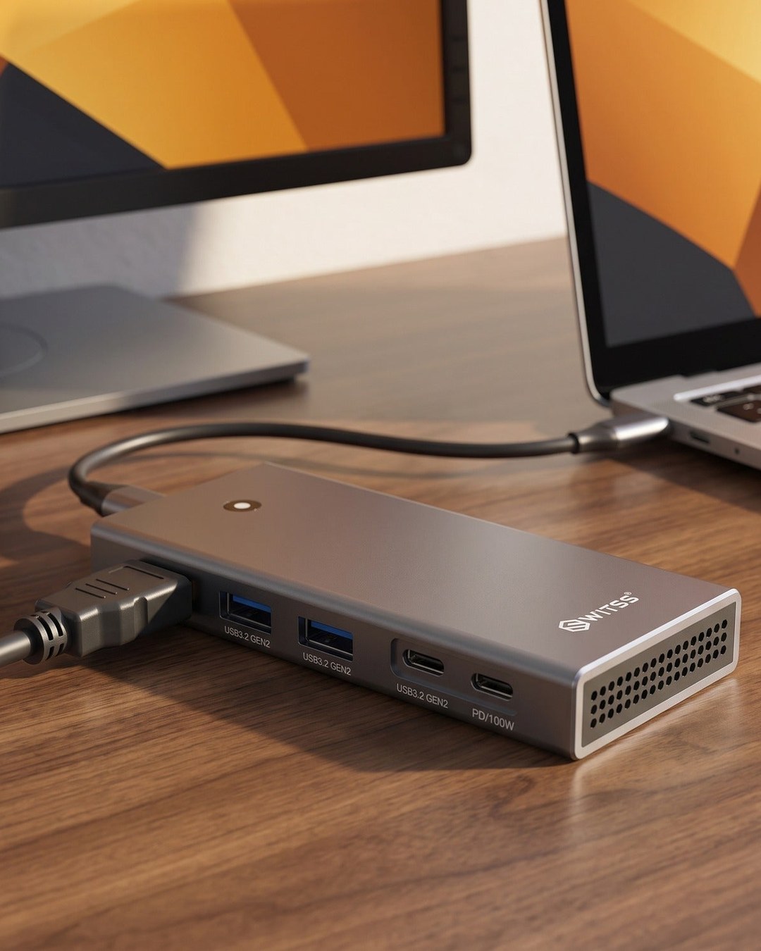 Switss® 5-in-1 docking station connecting a laptop and a monitor with a single USB-C cable