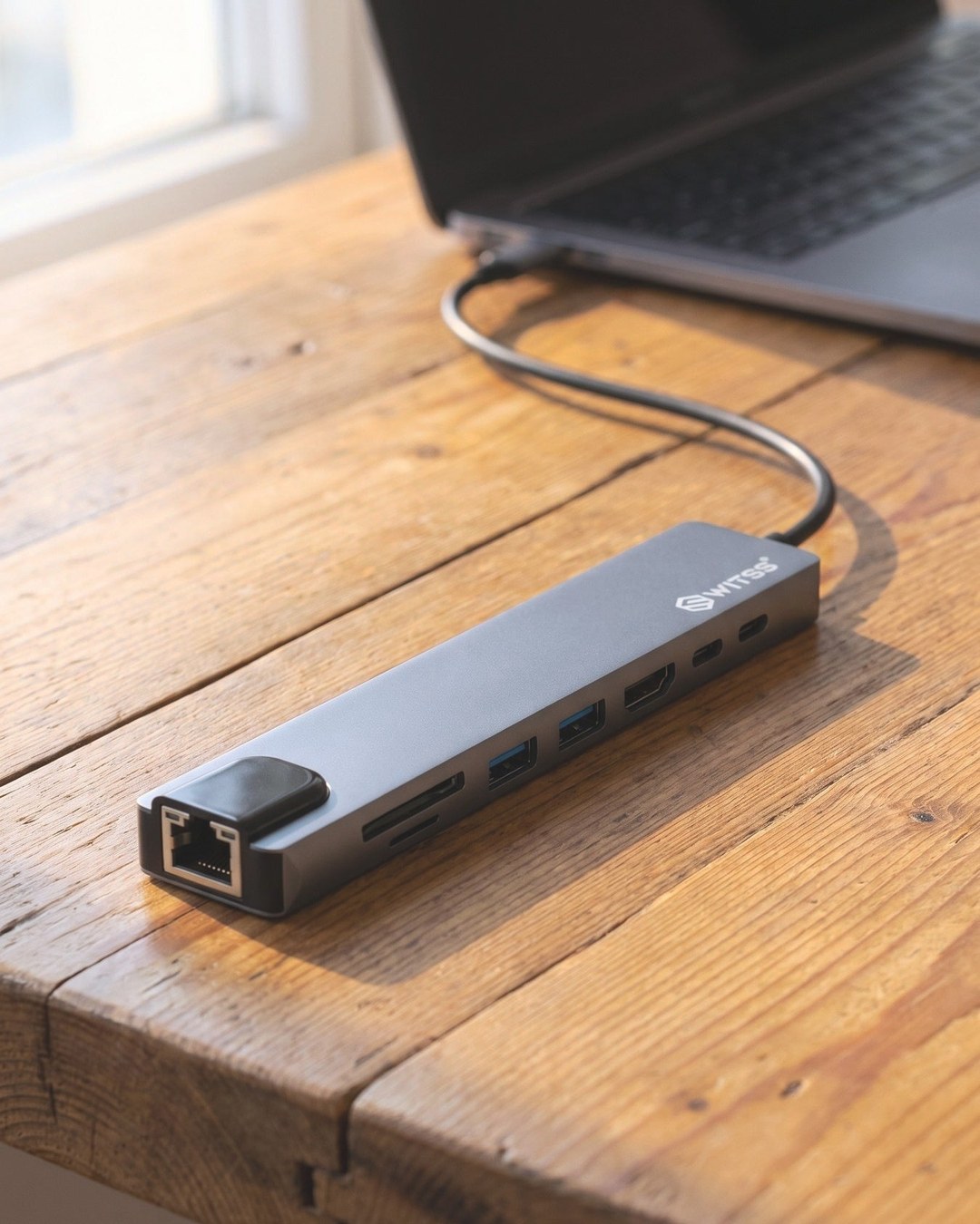 Switss® 8-in-1 USB-C hub with extra ports connected to a laptop
