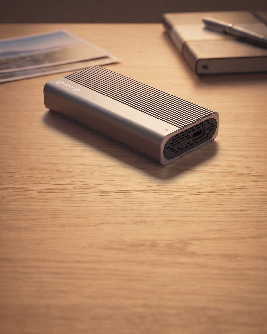 Switss® USB4 M.2 SSD enclosure on a wooden desk