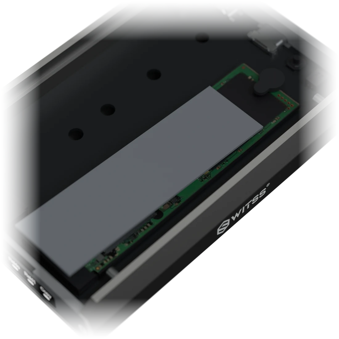 Close-up of the thermal pad going onto the SSD, with a ring around the plug in the hole