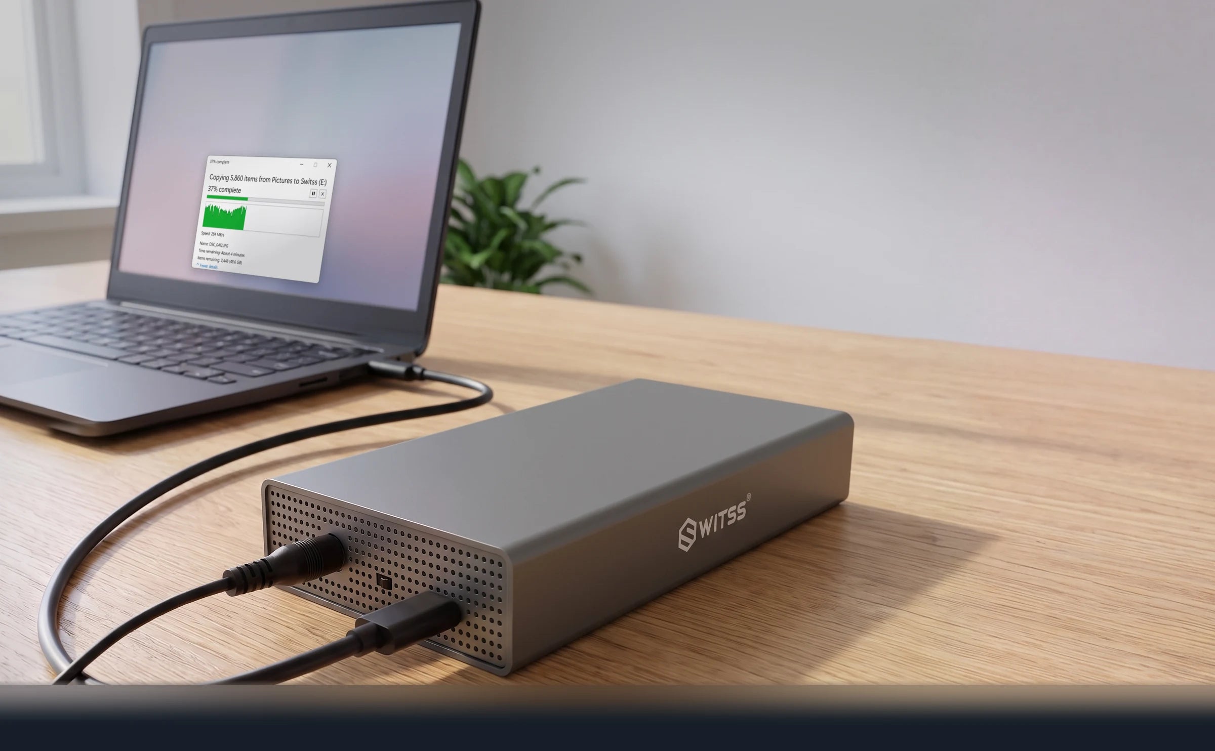 The Switss 3.5 inch enclosure connected to a laptop, with a file copy to the drive in progress on the screen
