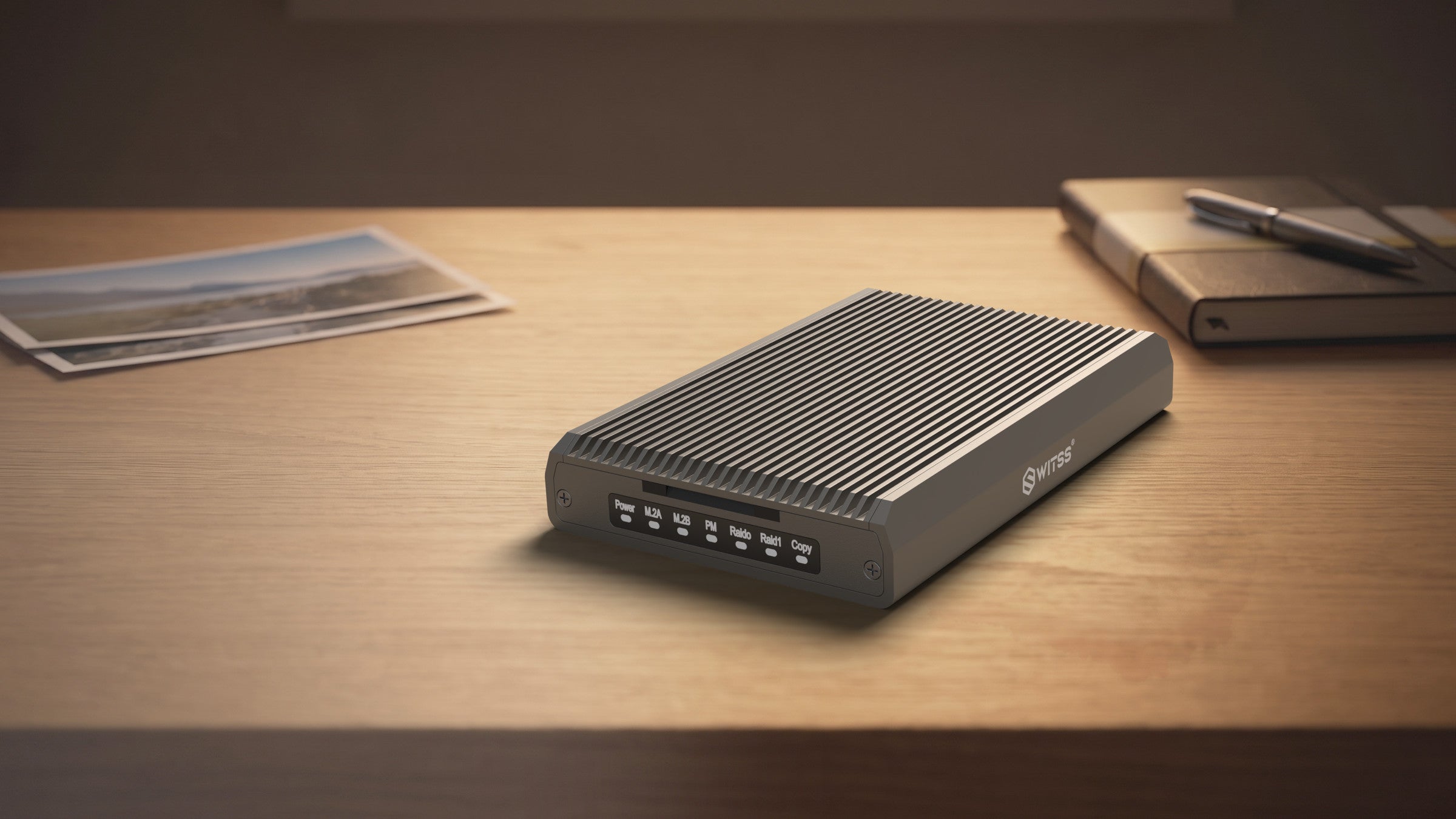 Switss® RAID dual-bay enclosure on a walnut desk, connected to a laptop